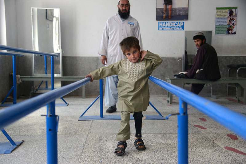 Sayed learning to walk again at Handicap International's rehabilitation centre in Kandahar, Afghanistan.