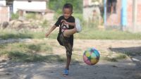 Prabin, 6, plays football.