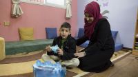 Helem and her son Ahmad in the school's resource room 
